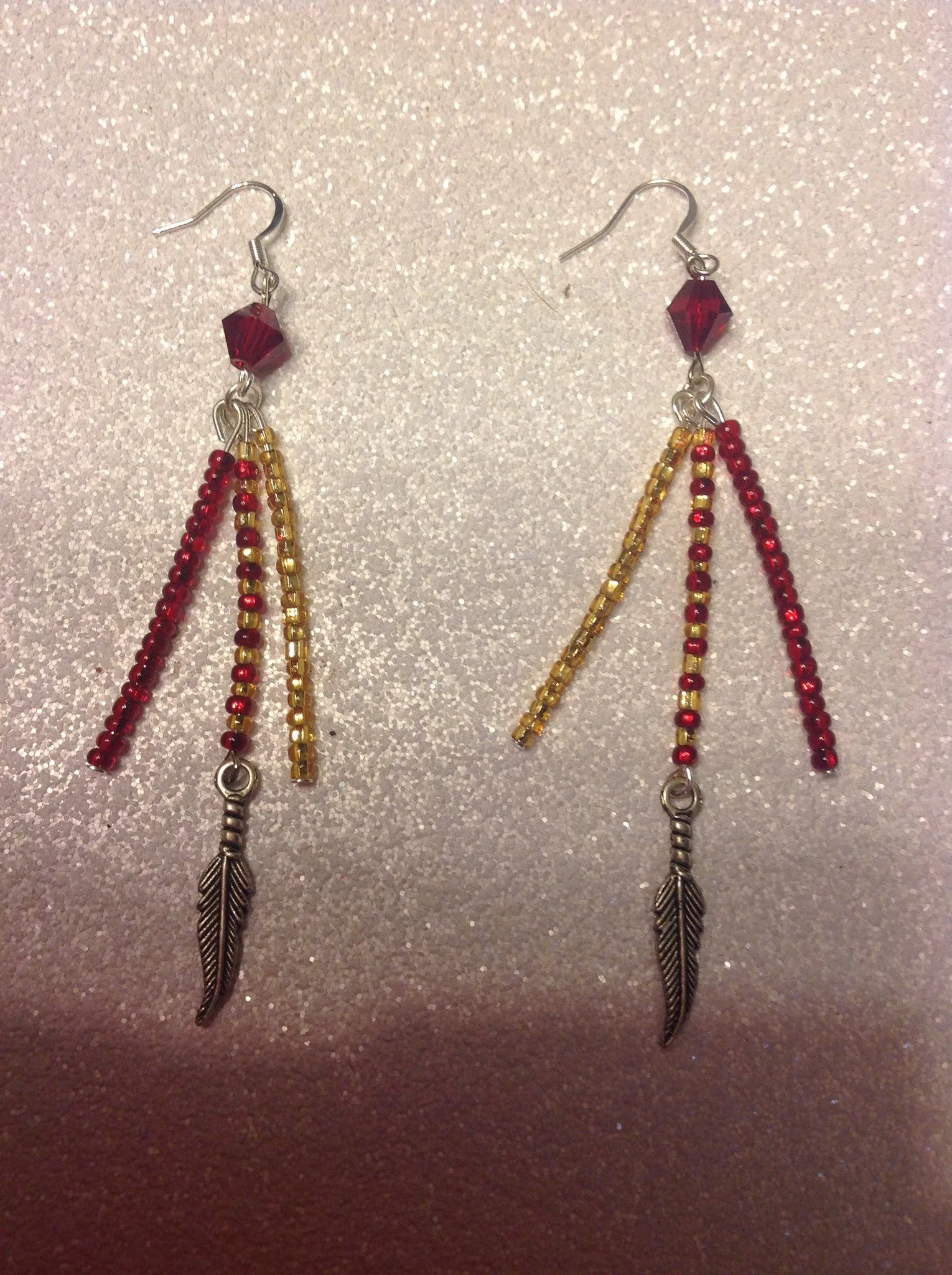 Garnet and gold Seminole earrings.